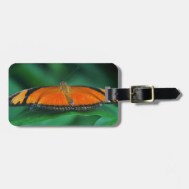 Helle Orange und schwarze Schmetterlinge auf der l Gepäckanhänger
