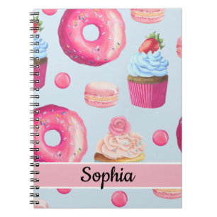 Helle rosa Donuts und Cupcakes auf Babyblau Notizblock