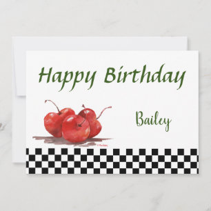 Helle rote Kirschen auf einem karierten Tablettenk Feiertagskarte