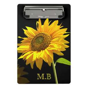 Helle Sonnenblume auf schwarzem Hintergrund Mini Klemmbrett