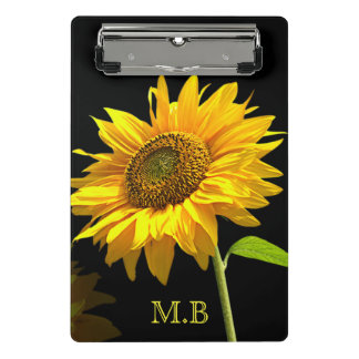 Helle Sonnenblume auf schwarzem Hintergrund Mini Klemmbrett