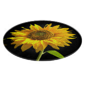 Helle Sonnenblume auf schwarzem Hintergrund Schneidebrett (Ecke)