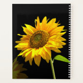 Helle Sonnenblume im schwarzen Hintergrund Planer (Rückseite)