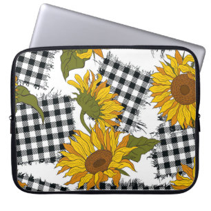 Helle Sonnenblumen-Blume auf karierten Pflastern.  Laptopschutzhülle