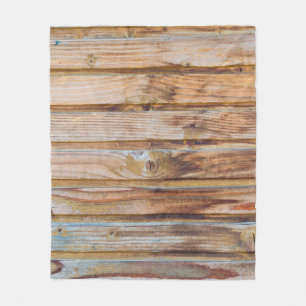 Helle Vintage Holzplanken im Hintergrund. Hori Fleecedecke