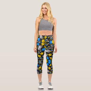 Helles abstraktes Blumenmuster auf schwarzem Hinte Capri Leggings