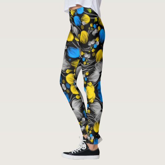 Helles abstraktes Blumenmuster auf schwarzem Hinte Leggings (Links)