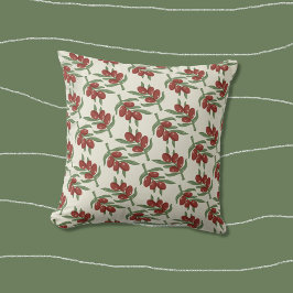 Hellgelbes Kissen mit rotem Olivenmuster