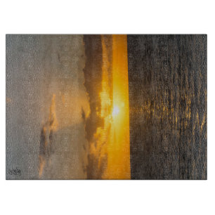 Helliger Sonnenuntergang über dem Ozean Schneidebrett