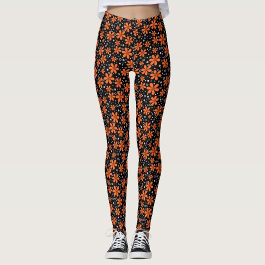 Hellorange Blume auf schwarzem Hintergrund mit w Leggings (Vorderseite)