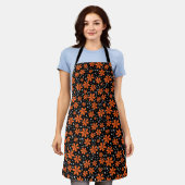 Hellorange Blume auf schwarzem Hintergrund mit w Schürze (Getragen)