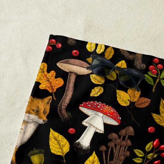 Herbstfüchse auf schwarz strandtuch (Beispiel)