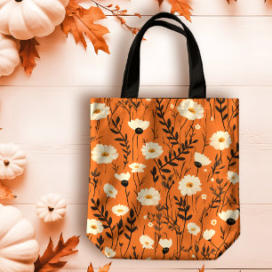 Herbstweiße Tageszeitungen auf Orange Tasche