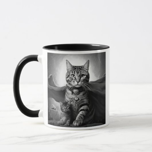 Heroische Katze mit Umhang und Kätzchen. Tasse (Links)