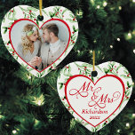 Herr und Frau Newlywed Christmas Keramik Ornament<br><div class="desc">Feiern Sie Ihren besonderen Tag mit diesem wunderschönen, herzförmigen Herrn und Frau Ornament für frisch vermählte! Passen Sie einfach mit Ihrem eigenen Foto auf der Vorderseite und Ihrem Nachnamen und dem Hochzeitsjahr auf der Rückseite, auf einem süßen Aquarellfarben-Hintergrund, für einen wahren Schatz, den Sie für die nächsten Jahre zu schätzen...</div>