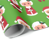 Herr und Frau Santa Clause über einen grünen Hinte Geschenkpapier (Rolleneckpunkt)