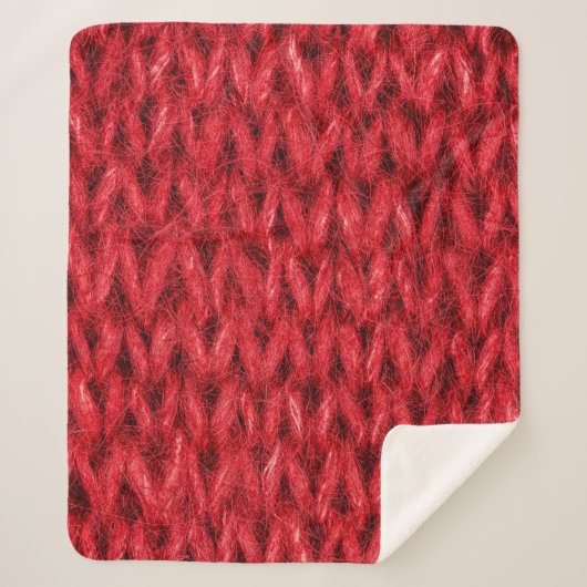 Hintergrund aus roter Strickwolle. Sherpadecke (Vorderseite)