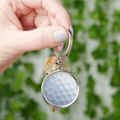 Hintergrund des Golftönens Schlüsselanhänger (Hand)