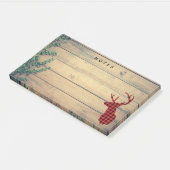 Hirschhaut mit Antlern auf Holzplanken mit Blätter Post-it Klebezettel (angewinkelt)