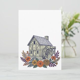 Historische Mühle mit Herbstblumen