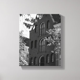 Historisches Gebäude in Schwarz/Weiß in Amsterdam Leinwanddruck