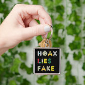 Hoax Lies Fake Schlüsselanhänger (Hand)