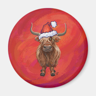 Hochlandkuh in Weihnachtsmannmütze auf Rot Magnet