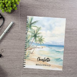 Hochzeit am Strand von Bridesmaid Notizblock<br><div class="desc">Ein tropischer Strand,  Wellen und Palmen,  Aquarell. Personalisieren Sie den Namen Ihrer Brautjungfrau und fügen Sie ihn hinzu. Schwarzes handgeschriebenes Stilskript.</div>