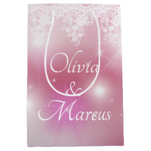 Hochzeits-Spitze auf rosa Bokeh Mittlere Geschenktüte
