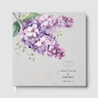 Hochzeitsgästebuch mit lila Blumen und Gold verzie