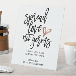 Hochzeitspread-Liebe nicht Keime nehmen eine Maske Sockelschild