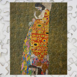 Hoffnung II von Gustav Klimt, Vintager Jugendstil Puzzle<br><div class="desc">Hope II (1907/08) von Gustav Klimt ist ein Vintages Viktorianisches Era Symbolismus-Kunstbild, in dem eine schwangere Dame über ihren großen Bauch hinabschaut, um einen menschlichen Schädel zu sehen. Es gibt drei Frauen in der Nähe ihrer Füße, die in das komplizierte Muster ihres Gewebes eingewoben sind. Die Frau hat Brüste freigelegt...</div>
