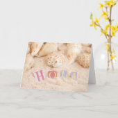 Hola, hallo auf Spanisch an einem Sandstrand Karte (Gelbe Blume)