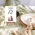 Holly and Candle Winter Wedding Tischnummer<br><div class="desc">Winterhochzeit-Tischnummer mit eleganter Typografie und romantischen Kerzen in Rot und Weiß, mit heiligen roten Beeren und einer Poinsettia-Blume dekoriert. Für die Koordinierung von Einladungen, Schreibwaren und Dekorationen während der Veranstaltung, schauen Sie bitte in der Holly Bells Wedding Collection nach oder schreiben Sie mir, um zusätzliche Artikel hinzuzufügen, die Sie benötigen....</div>