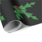 Holly und Holly Berries über das schwarze Wrapping Geschenkpapier (Rolleneckpunkt)