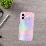 Holografischer Name des Einhornrosa-Tropfens iPhone 16 Hülle<br><div class="desc">Ein trendiger, irisierender Hintergrund mit Einhorn- und Regenbogenpastellfarben in Rosa, lila, Minzgrün. Dekoriert mit Imitaten Glitzer Tropfen in Rosa, lila und Regenbogenfarben eingetaucht. Lila Buchstaben. Personalisieren Sie Ihren Namen und fügen Sie ihn hinzu. Der Name wird mit einem modernen handgeschriebenen Stilskript mit Swashes geschrieben. Um die Swashes behalten, löschen Sie...</div>