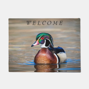 Hölzerne Ente in einem Teich Fußmatte