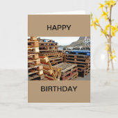 Hölzerne Paletten auf der Dock-alles- Gute zum Karte (Gelbe Blume)