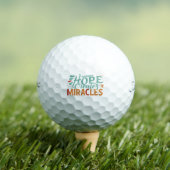 Hope Creates Miracles Golfball (Insitu T-Shirt)