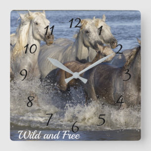 Horses galloping in the water quadratische wanduhr