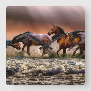 Horses Running in Ocean Surf at Sunset Quadratische Wanduhr
