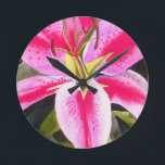 Hot pink lily Tenerife pop art watercolor flower Runde Wanduhr<br><div class="desc">with original design from watercolour painting by artist Sacha Grossel of hot pink lily flower in close up,  pop art macro style This botanical inspirred floral design is very bright and colourful with intense pink petals and green background.</div>