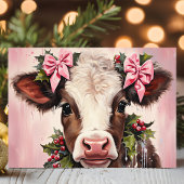 Hübsche Babykuh mit rosafarbenen Bogen Weihnachten
