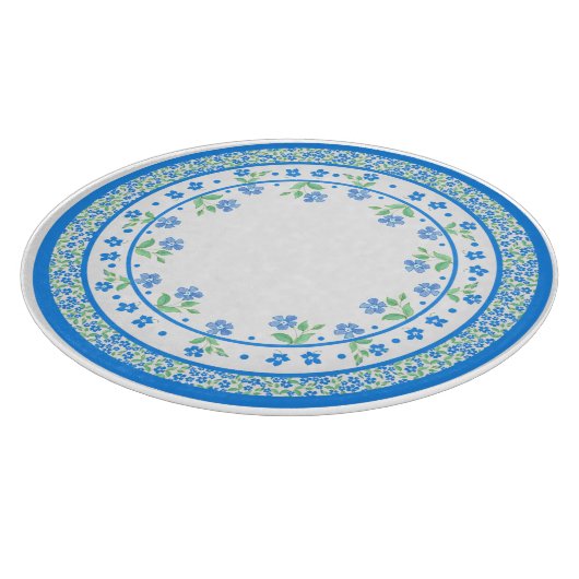 Hübsche blaugrüne Periwinkles, florale, rund um di Schneidebrett (Ecke)