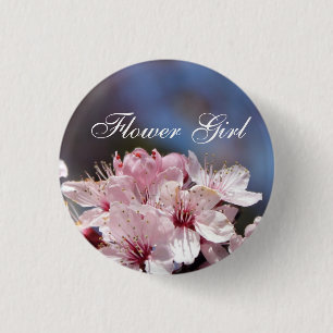 hübsche Frühlings rosa Kirschblüte in blauem Himme Button