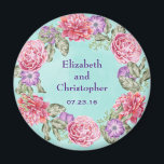 Hübsche Hochzeit mit Blumenwasser Magnet<br><div class="desc">Ein hübscher Hochzeitssake / Gedenk oder speichern Sie den Datums-Magneten. Eine wunderschöne botanische Themenabbildung mit einem kreisförmigen Kranz hübscher Aquarellfarben-Blume in Rosa und lila mit grünen Blätter dazwischen. Das Blumendesign besteht aus rosafarbenen Pfannkuchen und lila Anemonen. Der Hintergrund ist eine weiche, minzgrüne Aquarelltextur. Personalisieren Sie mit Ihren Namen und Hochzeitstermin....</div>