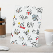 Hübsche Katzen, Milch und Magie. Sockelschild (In SItu)