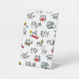 Hübsche Katzen, Milch und Magie. Sockelschild