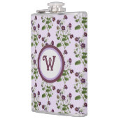 Hübsche lila und blumenreiche Reben mit Flachmann (Links)