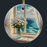 Hübsche Ozeanszene | Frohe Weihnachten Keramik Ornament<br><div class="desc">Eine hübsche Vase aus Blume auf einem Tisch vor einem Fenster mit Blick auf den Ozean. Schere weiße Vorhänge blasen in der Brise. Ai Art.</div>